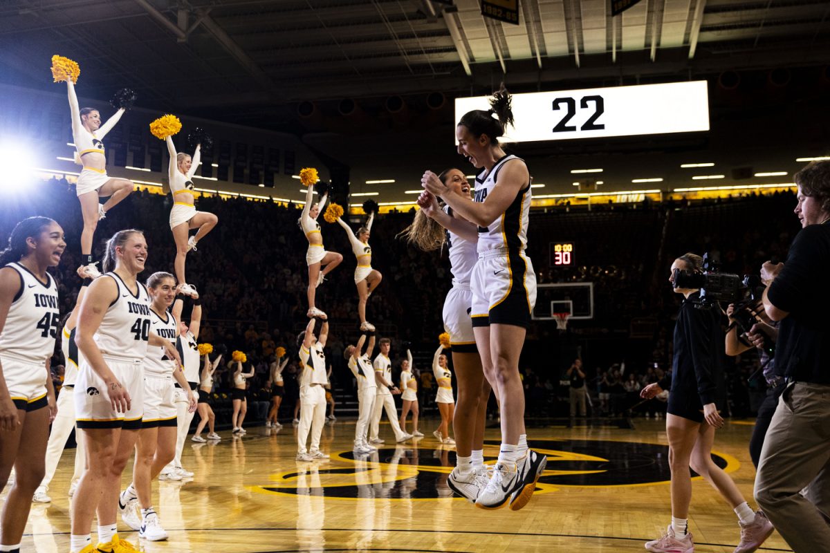 Iowa guard Caitlin Clark and /Iowa guard Gabbie Marshall jump after Clark gets introduced during a home opener basketball game between No. 3 Iowa and Fairleigh Dickinson at Carver-Hawkeye Arena on Monday, Nov. 6, 2023. Clark led Iowa in points with 28. The Hawkeyes, defeated the Knights, 102-46.