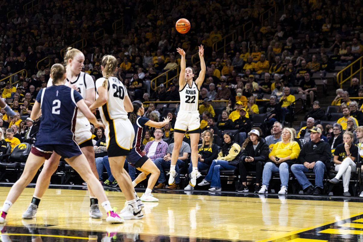 Iowa guard Caitlin Clark shoots a three-pointer during a home opener basketball game between No. 3 Iowa and Fairleigh Dickinson at Carver-Hawkeye Arena on Monday, Nov. 6, 2023. Clark had a double-double during the game, with 28 points and 10 assists. The Hawkeyes defeated the Knights, 102-46.