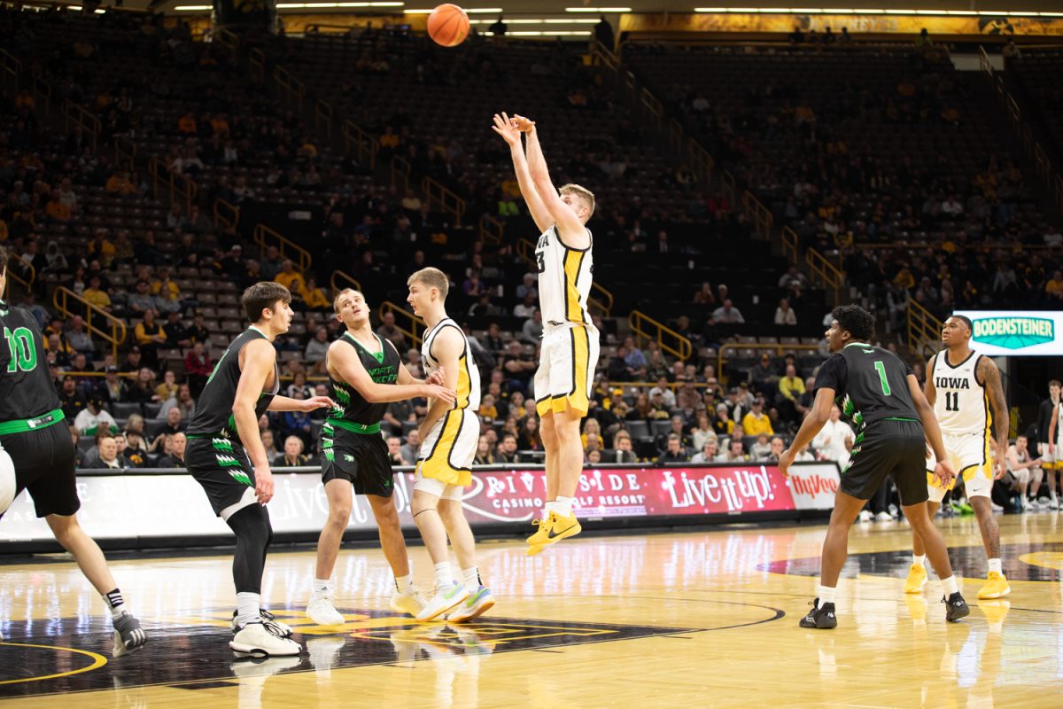 Iowa forward Ben Krikke shoots the ball during a mens basketball game between Iowa and North Dakota at Carver-Hawkeye Arena in Iowa City on Tuesday, Nov. 7, 2023. The Hawkeyes defeated the Fighting Hawks, 110-68.