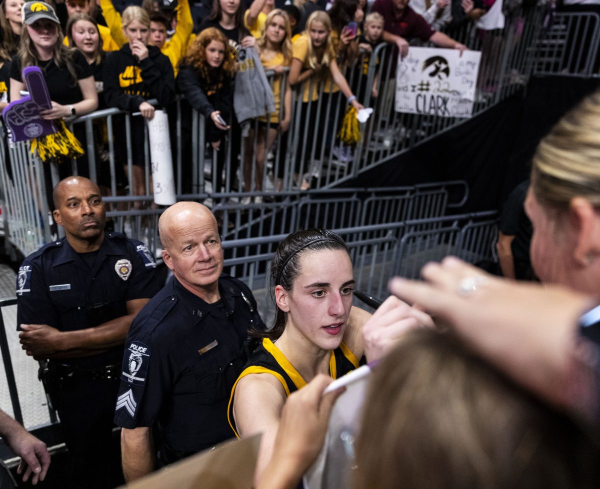 Iowa guard Caitlin Clark signs merchandise for fans after the Ally Tipoff, a basketball game between No. 3 Iowa and No. 8 Virginia Tech at Spectrum Center in Charlotte, N.C., on Thursday, Nov. 9, 2023. The Hawkeyes defeated the Hokies, 80-76. 
