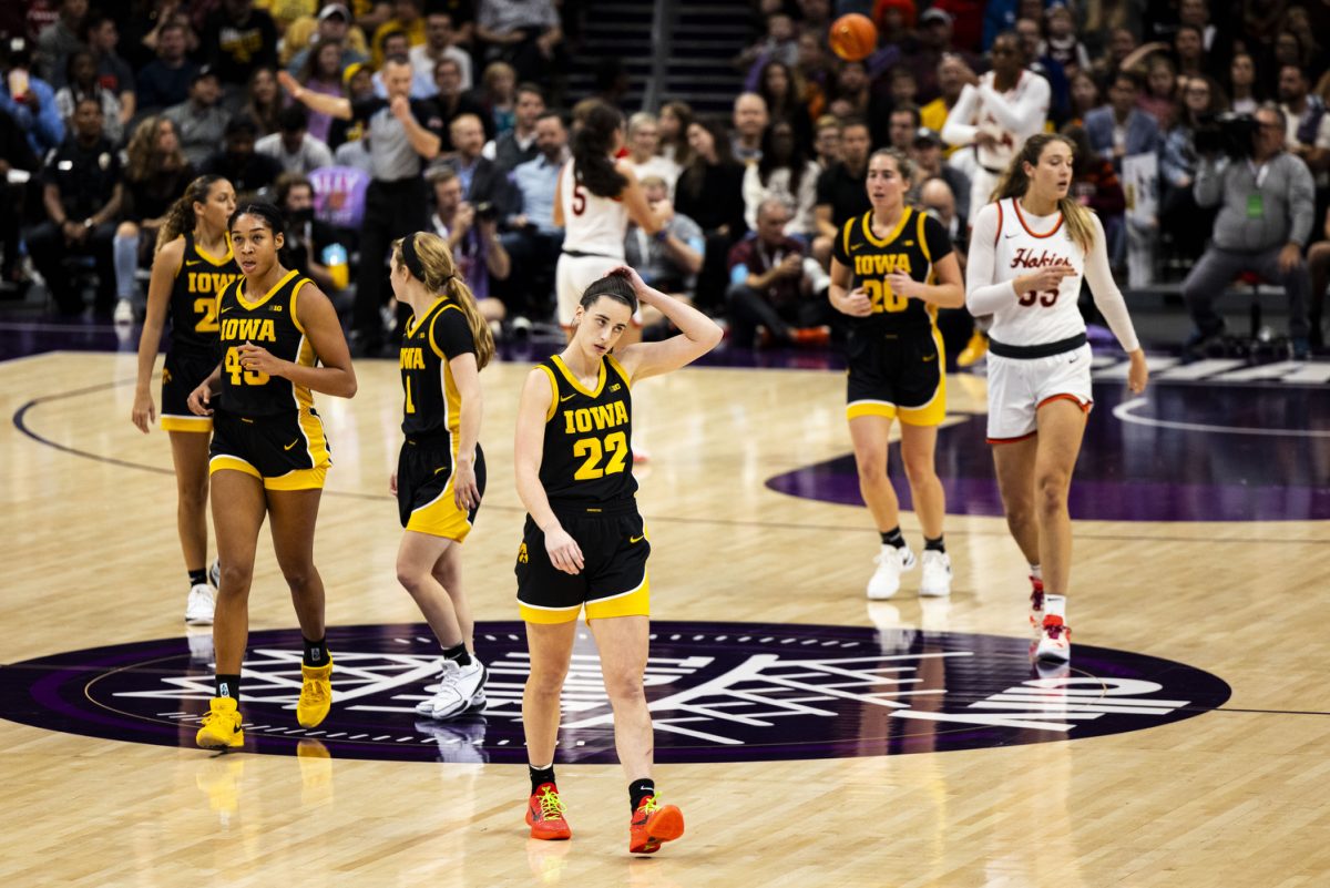 Iowa walks toward the bench for a timeout during the Ally Tipoff, a basketball game between No. 3 Iowa and No. 8 Virginia Tech at Spectrum Arena in Charlotte, N.C., on Thursday, Nov. 9, 2023. The Hawkeyes defeated the Hokies, 80-76.