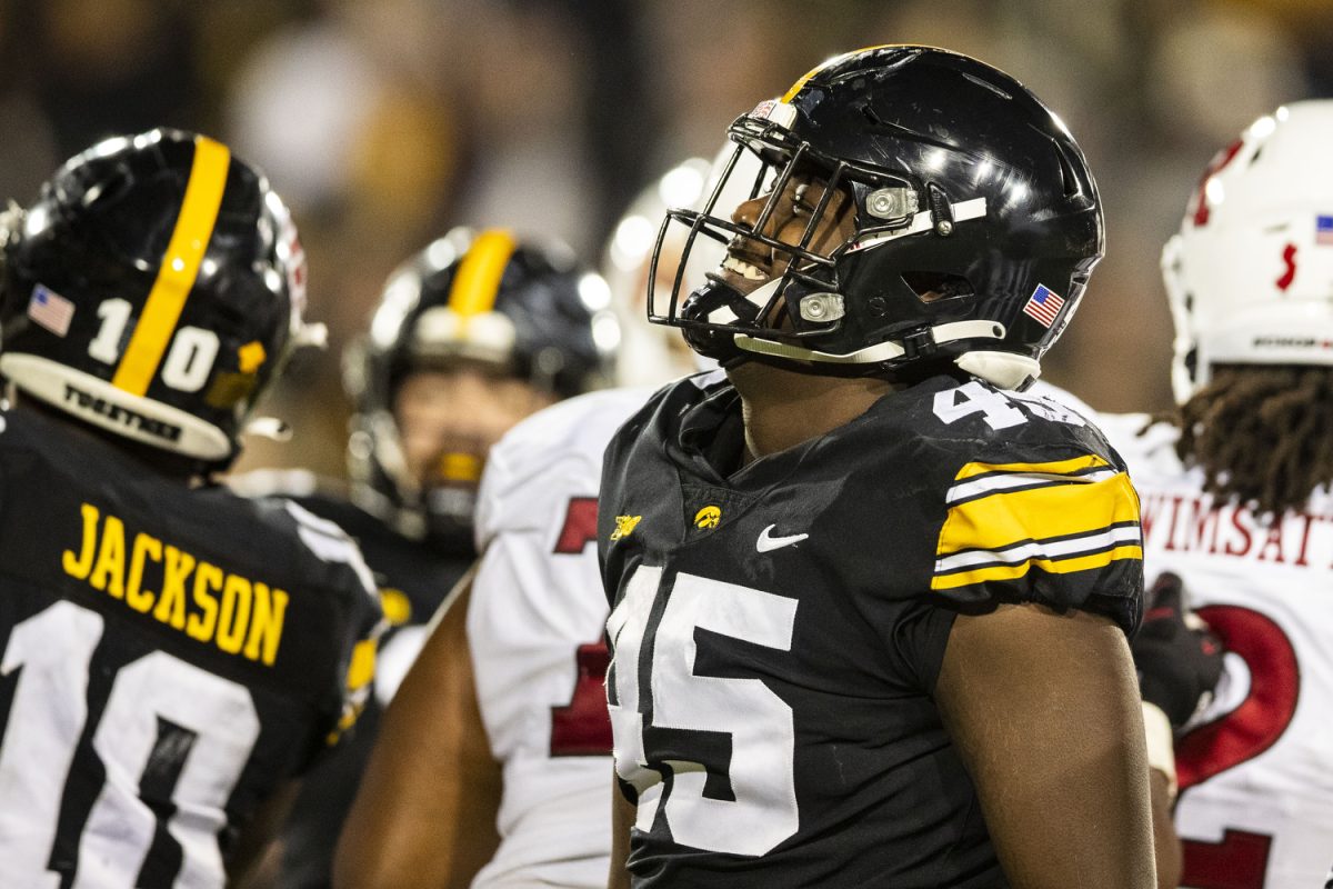 Iowa defensive lineman Deontae Craig smiles at fans during a football game between Iowa and Rutgers at Kinnick Stadium on Saturday, Nov. 11, 2023. Craig had three total tackles on the day. The Hawkeyes defeated the Scarlet Knights, 22-0.