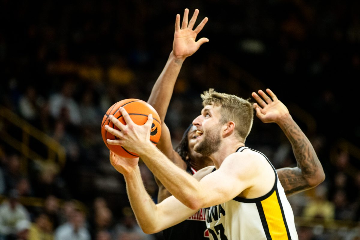 Iowa forward Ben Krikke goes up for a shot during a men’s basketball game between Iowa and Arkansas State at Carver-Hawkeye Arena on Friday, Nov. 17, 2023.
