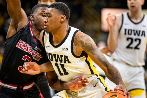 Ioaw guard Tony Perkins dribbles the ball during a men’s basketball game between Iowa and Arkansas State at Carver-Hawkeye Arena on Friday, Nov. 17, 2023. Iowa leads, 49-39, after the first half. 