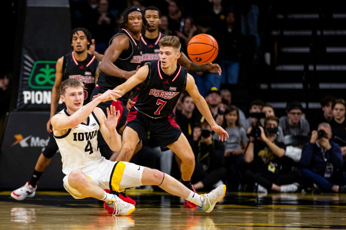 Iowa guard Josh Dix passes the ball during a men’s basketball game between Iowa and Arkansas State at Carver-Hawkeye Arena on Friday, Nov. 17, 2023. The Hawkeyes defeated the Red Wolves, 88-74.