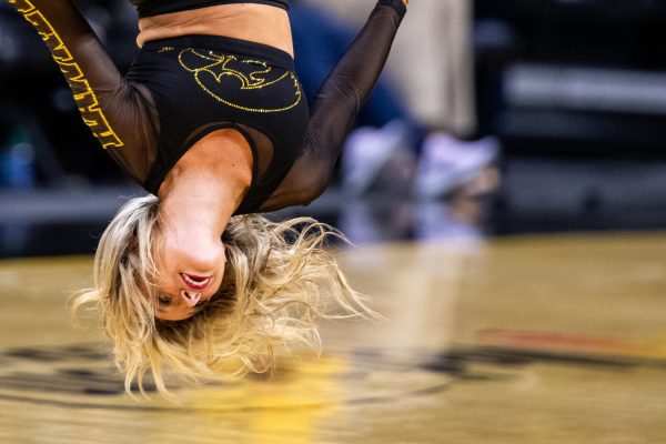 An Iowa dance member performs at halftime during a men’s basketball game between Iowa and Arkansas State at Carver-Hawkeye Arena on Friday, Nov. 17, 2023. The Hawkeyes defeated the Red Wolves, 88-74.