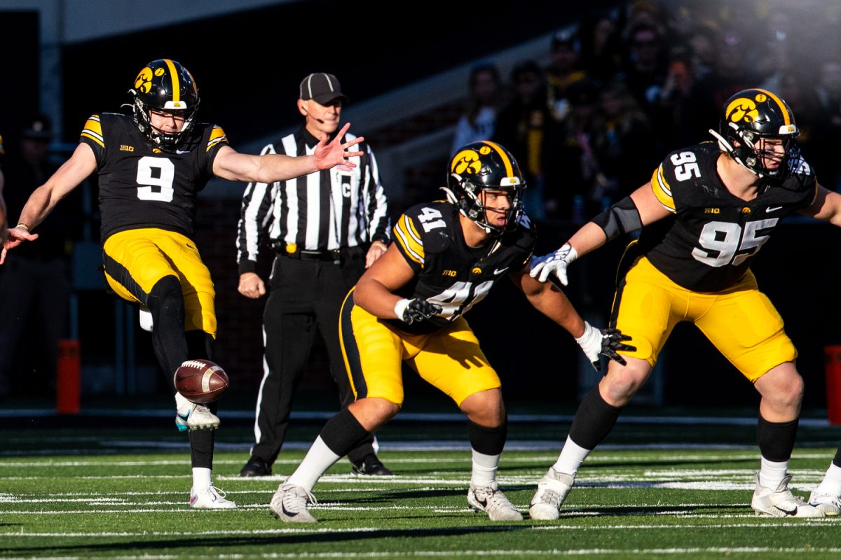 Iowa+punter+Tory+Taylor+punts+the+ball+during+a+football+game+between+Iowa+and+Illinois+at+Kinnick+Stadium+on+Saturday%2C+Nov.+18%2C+2023.+Taylor+punted+for+413+total+yards%2C+averaging+51.6+per+play.+The+Hawkeyes+defeated+the+Fighting+Illini%2C+15-13.