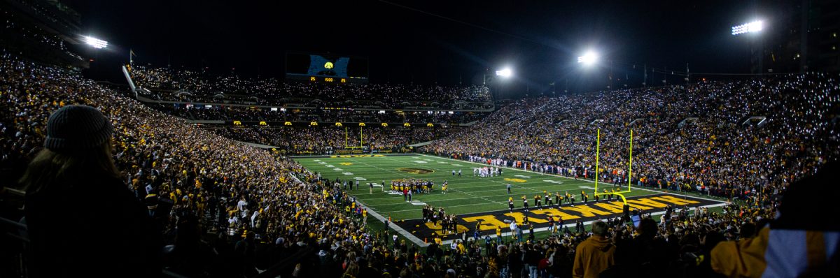 Fan’s turn on their flashlights at the start of the fourth quarter during a football game between Iowa and Illinois at Kinnick Stadium on Saturday, Nov. 18, 2023. The Hawkeyes defeated the Fighting Illini, 15-13.