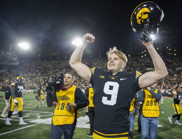 Iowa punter Tory Taylor acknowledges fans after a football game between Iowa and Illinois at Kinnick Stadium in Iowa City on Saturday, Nov. 18, 2023. Taylor punted for 413 total yards, averaging 51.6 per play. The Hawkeyes defeated the Fighting Illini 15-13.