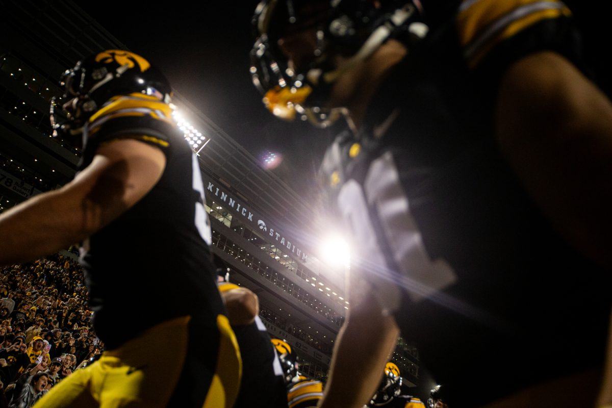 Iowa+players+run+off+the+field+after+a+football+game+between+Iowa+and+Illinois+at+Kinnick+Stadium+on+Saturday%2C+Nov.+18%2C+2023.+The+Hawkeyes+defeated+the+Fighting+Illini%2C+15-13.