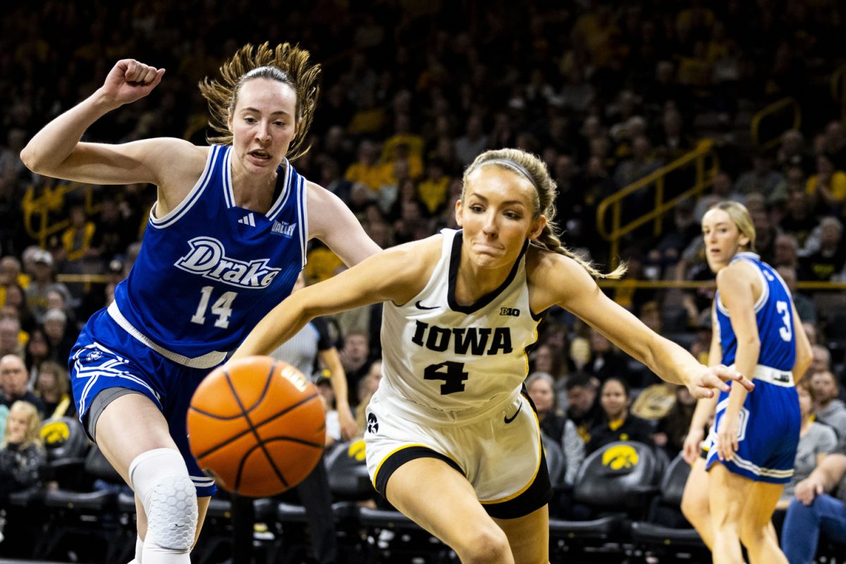 Iowa+guard+Kylie+Feuerbach+and+Drake+forward+Anna+Miller+fight+for+a+rebound+during+a+basketball+game+between+No.+2+Iowa+and+Drake+at+Carver-Hawkeye+Arena+in+Iowa+City+on+Sunday%2C+Nov.+19%2C+2023.+Drake+had+34+total+rebounds+compared+to+Iowa%E2%80%99s+26.+The+Hawkeyes+defeated+the+Bulldogs+in+the+sold-out+arena%2C+113-90.