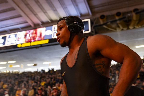Iowa’s 174-pound Gabe Arnold walks onto the mat during a men’s wrestling dual between No. 3 Iowa and No. 16 Oregon State at Carver-Hawkeye Arena on Sunday, Nov. 19, 2023. Arnold, a true freshman, made his Carver debut. The Hawkeyes defeated the Beavers, 25-11.