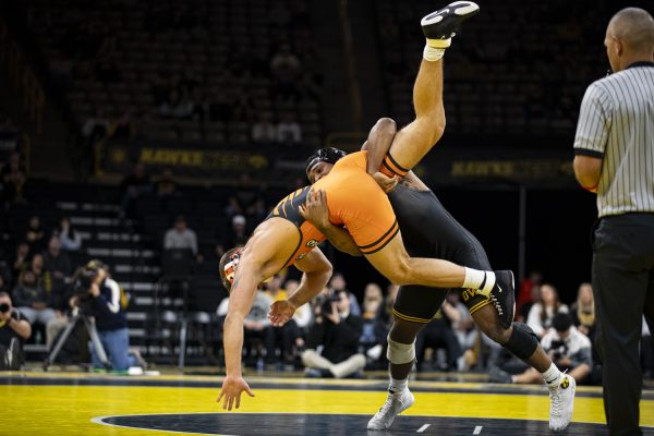 Iowa’s 174-pound Gabe Arnold wrestles Oregon State’s No. 11 Travis Wittlake during a men’s wrestling dual between No. 3 Iowa and No. 16 Oregon State at Carver-Hawkeye Arena on Sunday, Nov. 19, 2023. Arnold defeated Wittlake by decision, 4-2. The Hawkeyes defeated the Beavers, 25-11.