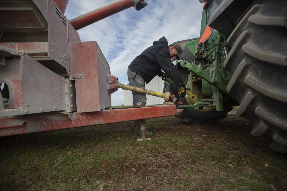 Steve Swenka hooks up a Gehl grinder-mixer to his tractor at Double G Angus Farms in Tiffin on Wednesday, Nov. 1, 2023. Double G Farms has been open for 111 years and is currently owned by Steve Swenka and his wife, Amy. 