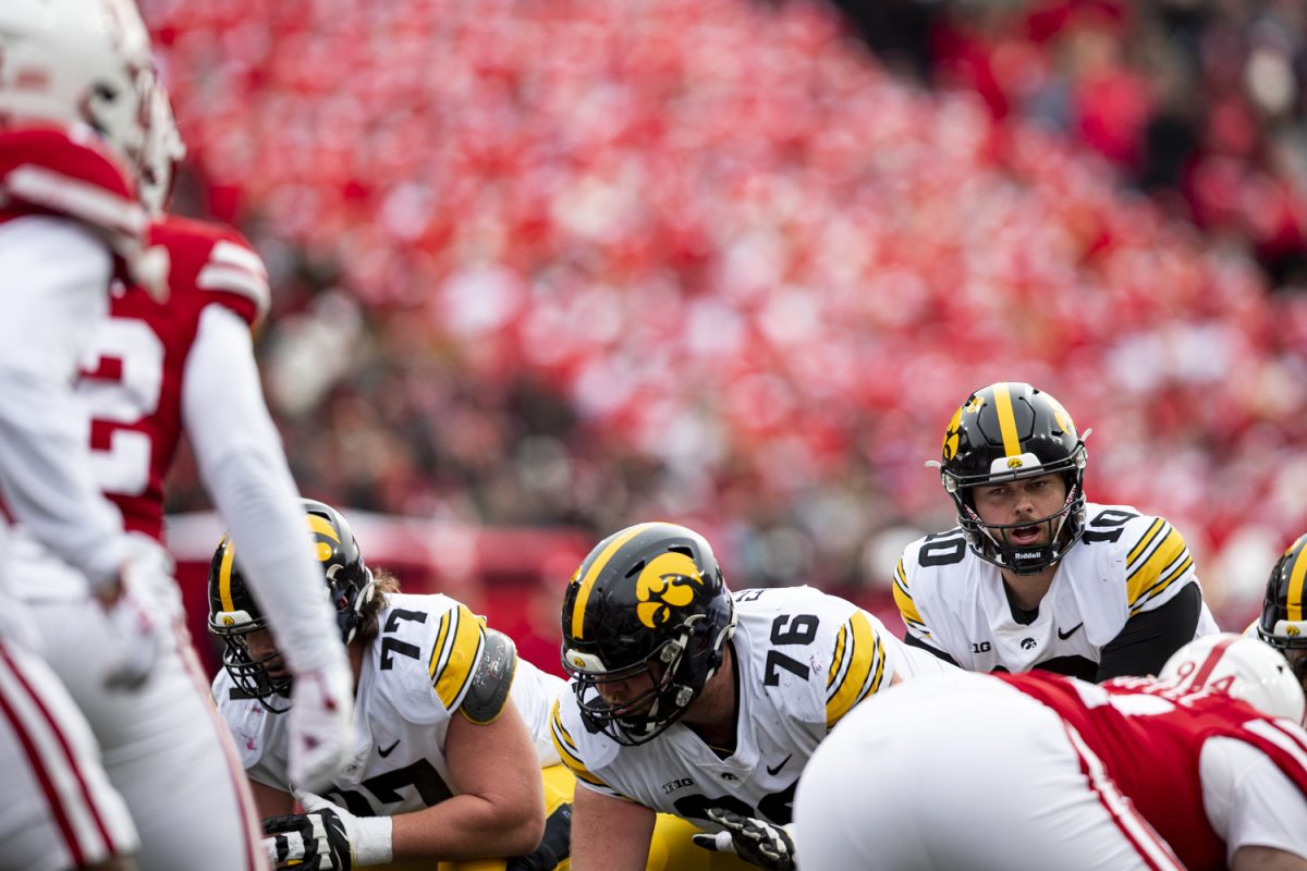 Iowa quarterback Deacon Hill prepares to snap the ball during a football game between Iowa and Nebraska at Memorial Stadium in Lincoln Nebraska on Friday, Nov. 23, 2023. The Hawkeyes defeated the Cornhuskers 13-10.