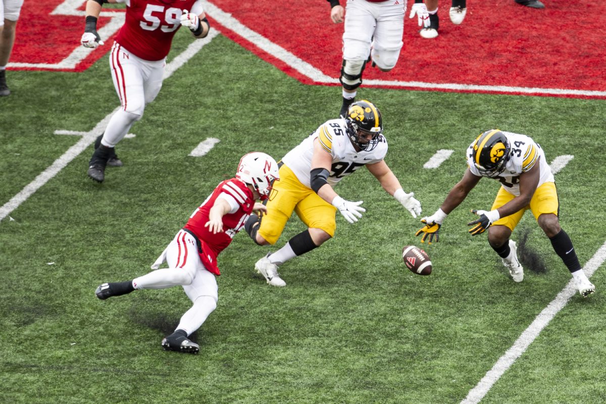 Iowa+defensive+lineman+%09Aaron+Graves+and+linebacker+Jay+Higgins+dive+for+the+ball+during+a+football+game+between+Iowa+and+Nebraska+at+Memorial+Stadium+in+Lincoln+Nebraska+on+Friday%2C+Nov.+23%2C+2023.+The+Hawkeyes+defeated+the+Cornhuskers+13-10.