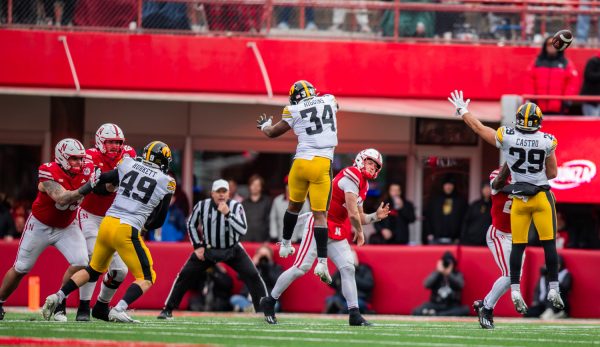 Iowa linebacker Jay Higgins and Iowa defensive back Sebastian Castro attempt to block a pass by Nebraska quarterback Chubba Purdy during a football game between No. 17 Iowa and Nebraska at Memorial Stadium in Lincoln, Nebraska, on Friday, Nov. 23, 2023. The Hawkeyes defeated the Cornhuskers, 13-10.