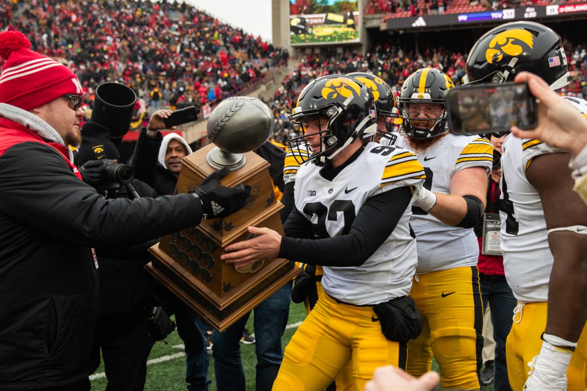 Iowa+kicker+Marshall+Meeder+receives+the+Heroes+Trophy+after+kicking+the+game+winning+field+goal+during+a+football+game+between+No.+17+Iowa+and+Nebraska+at+Memorial+Stadium+in+Lincoln%2C+Neb.%2C+on+Friday%2C+Nov.+23%2C+2023.+The+Hawkeyes+defeated+the+Cornhuskers+13-10.