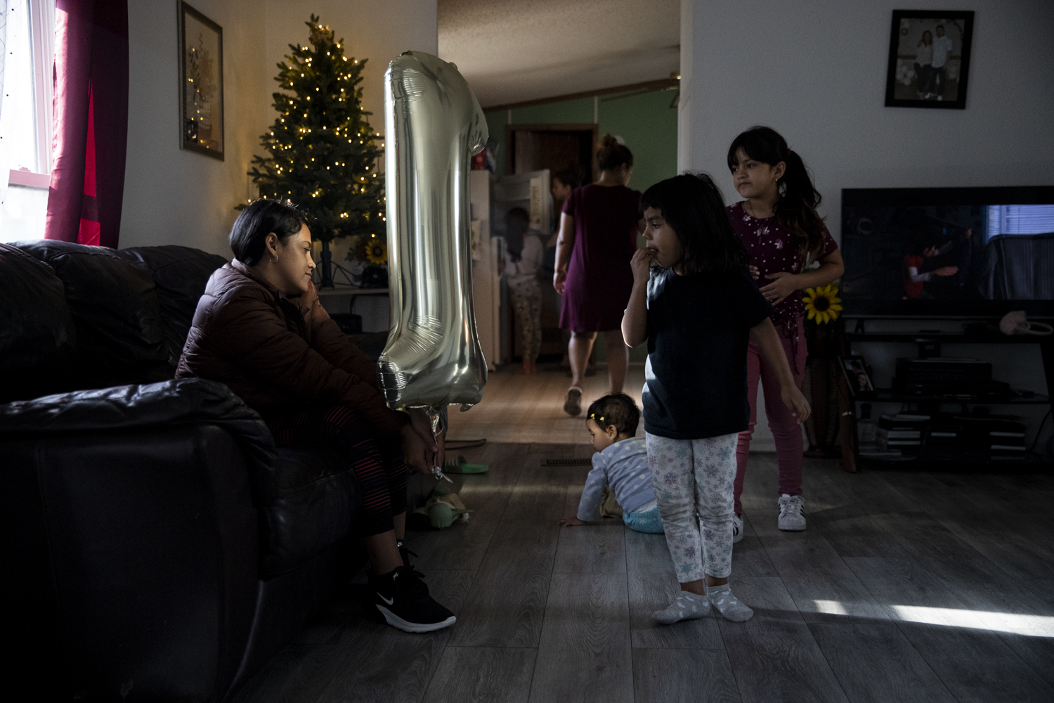 Children of the Vasquez Saravia family are seen in their home at Cole’s Mobile Home Court in Iowa City on Saturday, Nov. 25, 2023. 11 adults and 8 kids share the limited living space as well as a single bathroom in the trailer home.