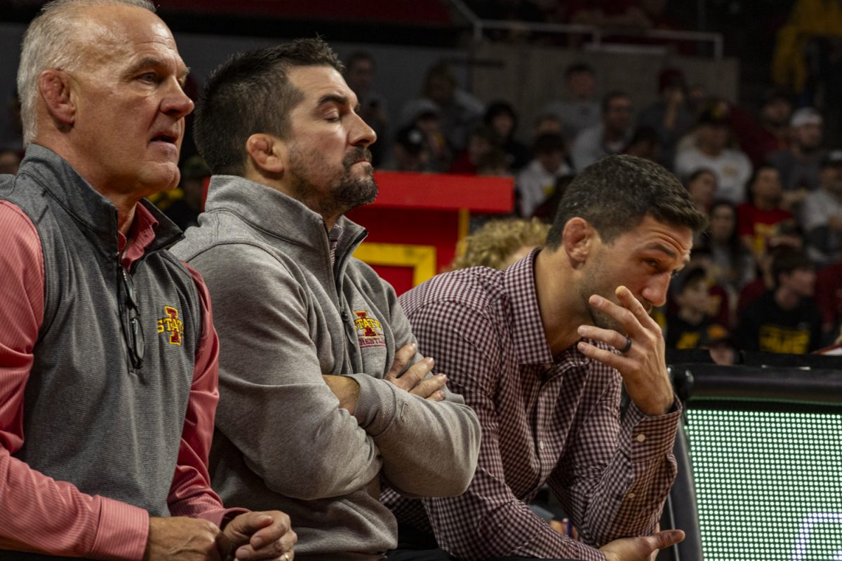 Iowa State coaches Kevin Dresser, Brent Metcalf and Derek St. John react to action during a Cy-Hawk men’s wrestling dual between No. 4 Iowa and No. 8 Iowa State at Hilton Coliseum on Sunday, Nov. 26, 2023. The Hawkeyes defeated the Cyclones, 18-14.