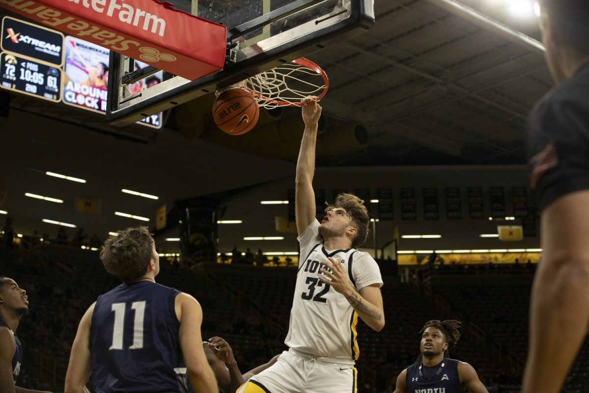 Owen Freeman dunks the ball during a men’s basketball game between Iowa and North Florida at Carver-Hawkeye Arena on Wednesday, Nov. 17, 2023. The Hawkeyes defeated the Ospreys, 103-78. Freeman scored 26 points and blocked 10 balls for Iowa.