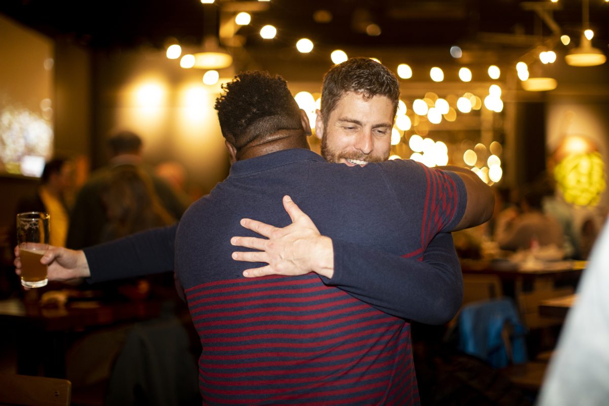 Iowa City City Council candidate Josh Moe and mayor Bruce Teague hug during a watch party for Moe at Big Grove Brewery in Iowa City, on Tuesday, Nov. 7, 2023. According to current results, Moe was elected At-Large and placed second with 5,909 votes. 