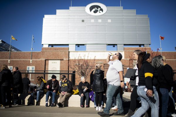 Iowa football fans line up outside Kinnick Stadium before a football game between No. 16 Iowa and Illinois in Iowa City on Saturday, Nov. 18, 2023. 