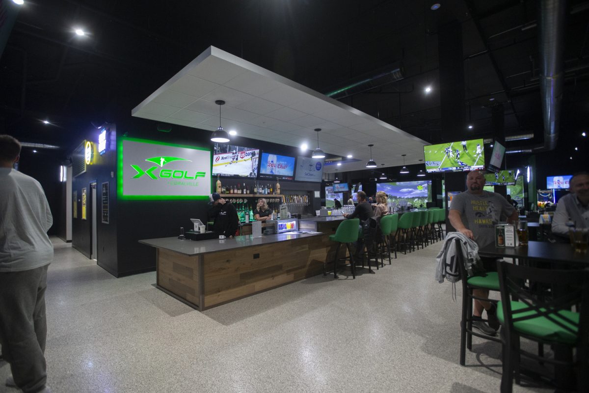 The bar at X-golf is seen in Coralville on Thursday, Nov. 2, 2023. X-golf offers drinks, golf simulators, and other games for patrons.