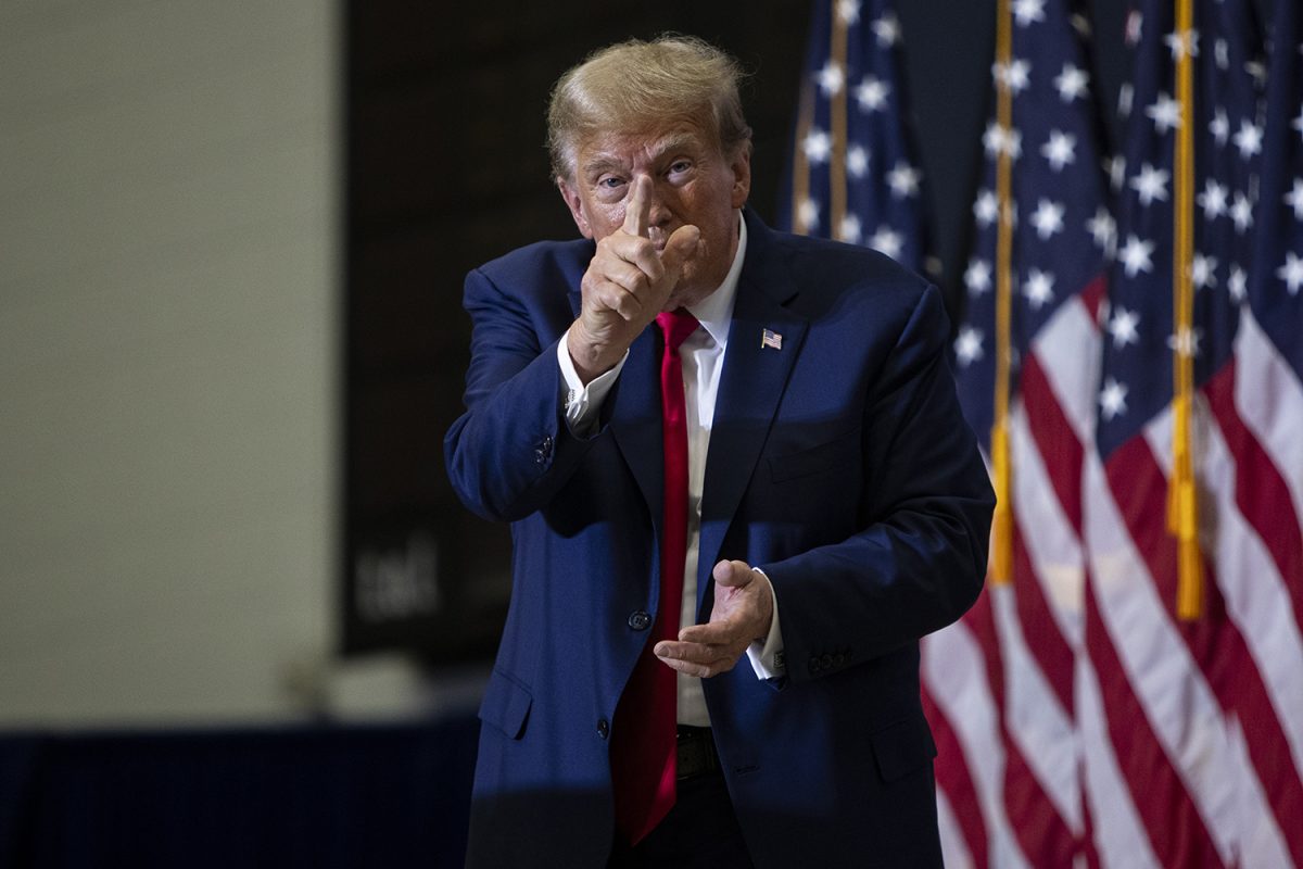 Former President Donald Trump points at the camera after a 2024 presidential campaign rally in Johnson Hall at Kirkwood Community College in Cedar Rapids on Saturday Dec. 2, 2023. 