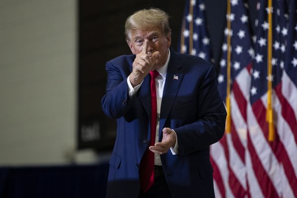 Former President Donald Trump points at the camera after a 2024 presidential campaign rally in Johnson Hall at Kirkwood Community College in Cedar Rapids on Saturday Dec. 2, 2023. 