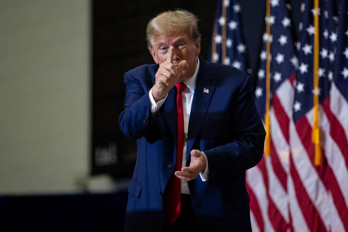 Donald Trump points at the camera after a 2024 presidential campaign rally in Johnson Hall of Kirkwood Community College in Cedar Rapids on Saturday, Dec. 2, 2023. 