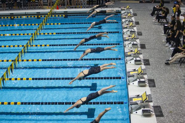Swimmers compete in the 200-yard fly during the final day of the Hawkeye Invitational at the University of Iowa Campus Recreation and Wellness Center on Saturday, Dec. 2, 2023. Iowa competed against Northern Iowa, Iowa State, Coe College, Nebraska, Rutgers, New Mexico State, and Colorado State.