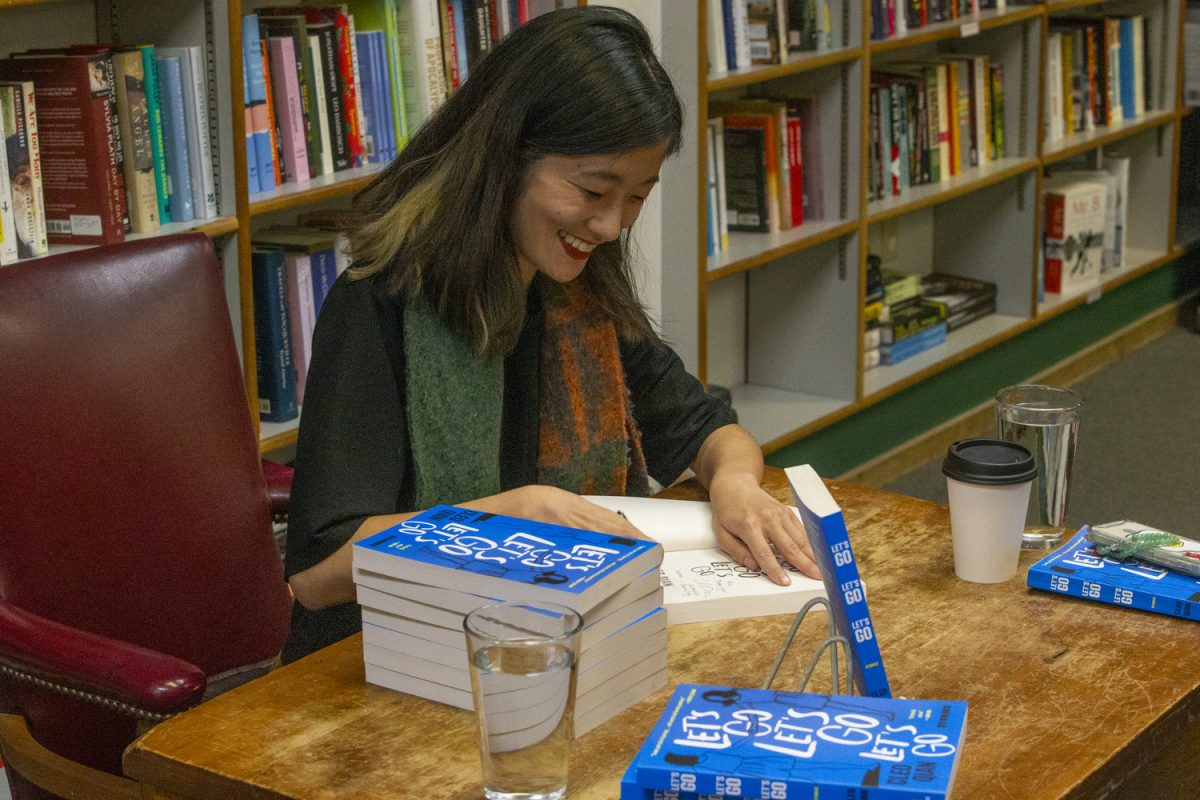 Writer and poet Cleo Qian reads from her book, “Let’s Go Let’s Go Let’s Go,” at Prairie Lights Bookstore in Iowa City on Monday, Dec. 4, 2023.