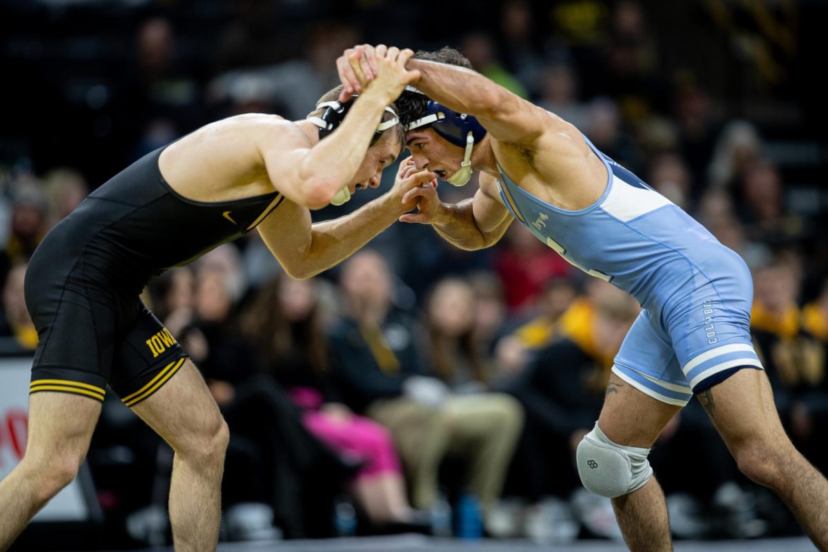 Iowas+Cullan+Schriever+wrestles+No.+11+Angelino+Rini+during+a+wrestling+dual+between+No.+4+Iowa+and+Columbia+at+Carver-Hawkeye+Arena+on+Friday%2C+Dec.+8%2C+2023.+The+Hawkeyes+defeated+the+Lions%2C+38-3.+Schriever+defeated+Rini+in+overtime%2C+9-6.