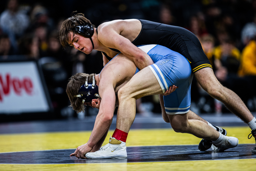 Columbia’s 149-pound Richard Fedalen takes on Iowa’s 149-pound Caleb Rathjen during a meet at Carver-Hawkeye Arena in Iowa City on Friday, Dec. 8, 2023.