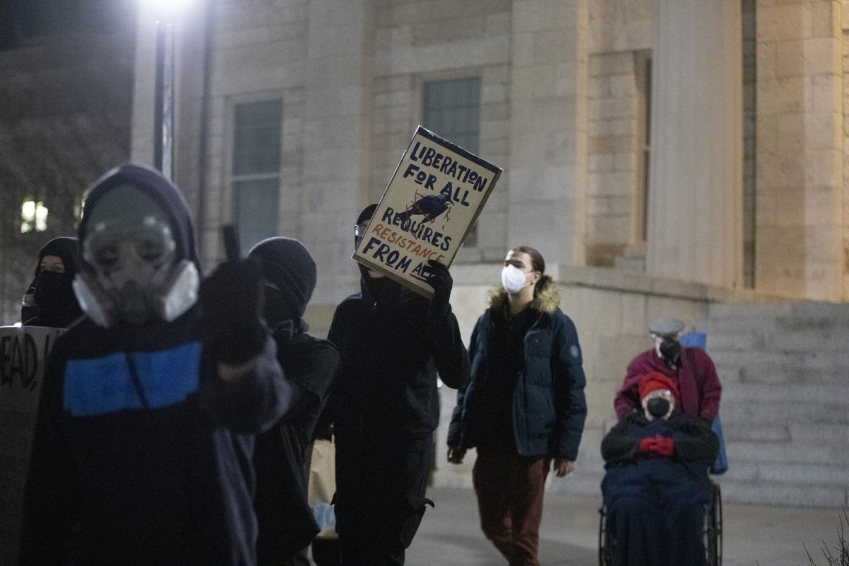 Protestors leave the Pentacrest during the Transgender Solidarity March in Iowa City on Friday, Dec. 8, 2023. The march began on the steps of the Old Capitol and circled around downtown Iowa City. 