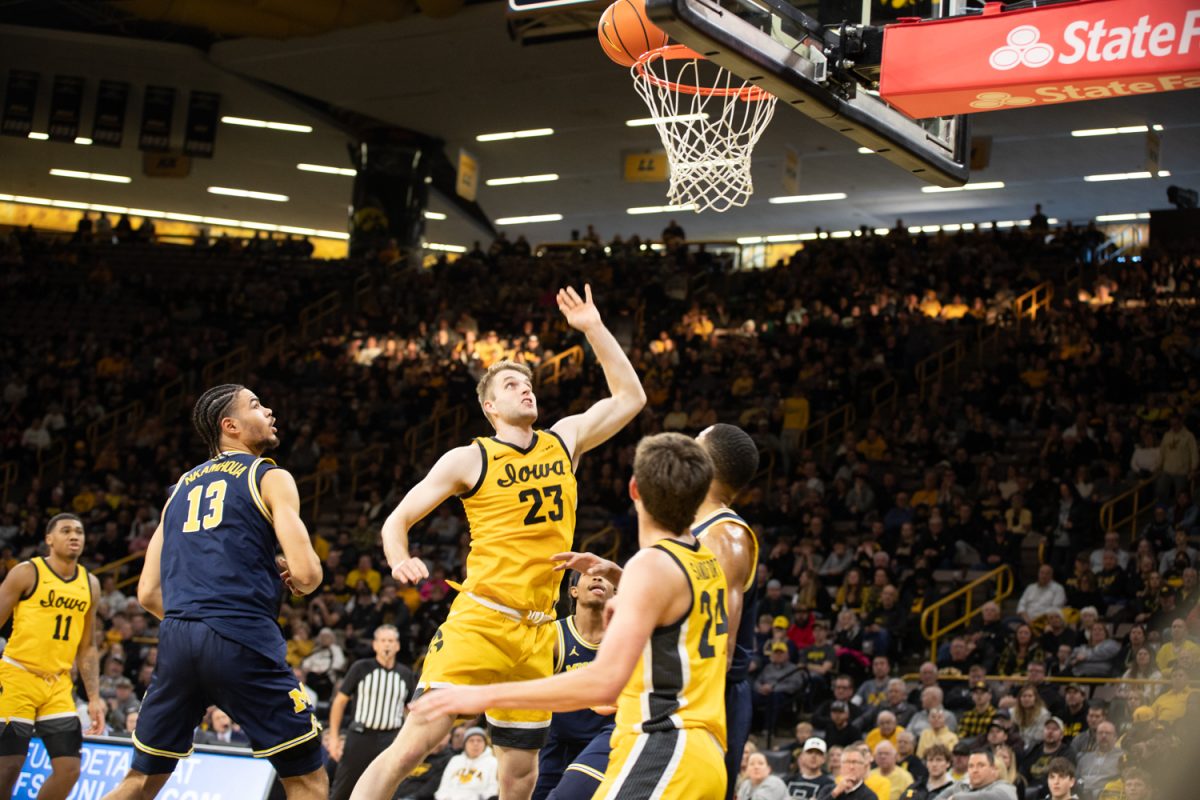 Ben+Krikke+goes+to+shoot+a+basket+during+a+men%E2%80%99s+basketball+game+between+Iowa+and+Michigan+at+Carver-Hawkeye+Arena+on+Dec.+10%2C+2023.