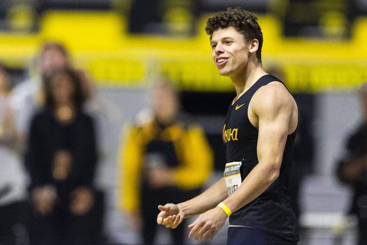 Iowa%E2%80%99s+Kalen+Walker+smiles+after+setting+a+meet+and+personal+record+time+of+6.59+in+the+men%E2%80%99s+60-meter+dash+during+the+Jimmy+Grant+Alumni+Invitational+at+the+Hawkeye+Indoor+Track+Facility+on+Saturday%2C+Dec.+9%2C+2023.+The+Hawkeyes+hosted+Western+Illinois+and+Wisconsin%2C+competing+in+events+including+the+pentathlon%2C+weight+throwing%2C+field+events%2C+and+various+running+events+at+the+indoor+track.