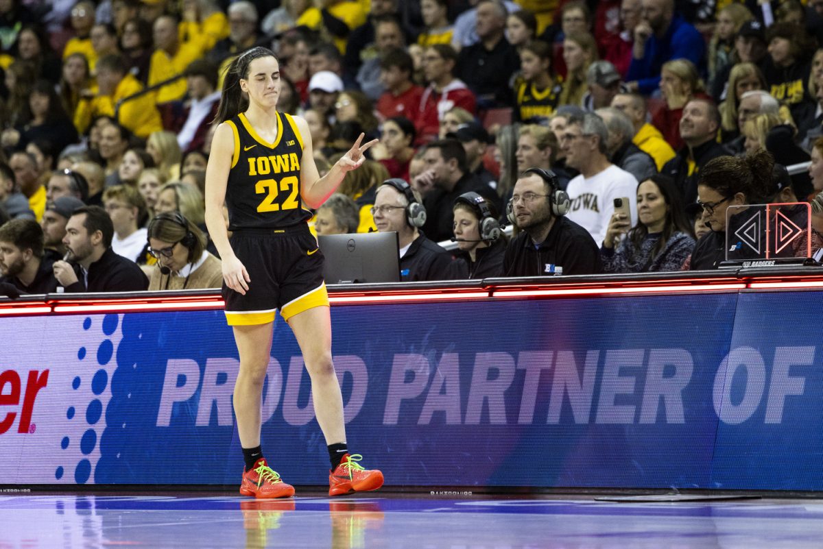 Iowa guard Caitlin Clark holds up her number to substitute into the game during a women’s basketball game between No. 4 Iowa and Wisconsin at a sold-out Kohl Center in Madison, Wisconsin, on Sunday, Dec. 10, 2023. The Hawkeyes defeated the Badgers, 87-65.