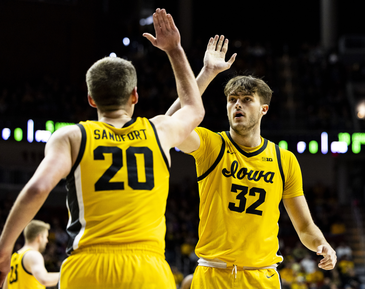 Iowa forward Payton Sandfort and Iowa forward Owen Freeman high five during game one of the Hy-Vee Hawkeye Showcase between Iowa men’s basketball and Florida A&M at Wells Fargo Arena in Des Moines, Iowa, on Saturday, Dec. 16, 2023. The Hawkeyes defeated the Rattlers 88-52.