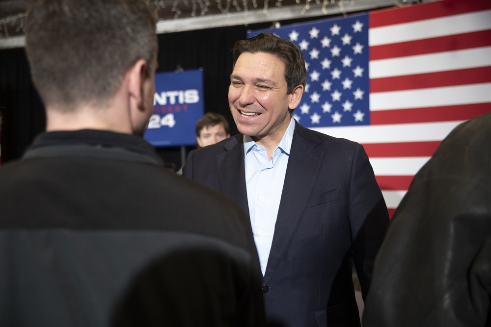 Republican presidential candidate and Florida Gov. Ron DeSantis greets his supporters after an event hosted by super PAC Never Back Down at the Veterans of Foreign Wars hall in Southwest Cedar Rapids on Tuesday, Dec. 19, 2023. In a crowd of 60 supporters, DeSantis emphasized his record as Governor of Florida and the legislative results he helped deliver in the state. “I don’t say things idly, when I’m doing it I think about how I’m going to actually get it accomplished,” DeSantis said.