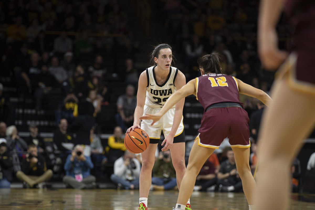 Iowa guard Caitlin Clark dribbles the ball during a women’s basketball game between No. 4 Iowa and Loyola-Chicago at Carver-Hawkeye Arena on Thursday, Dec. 21, 2023. 