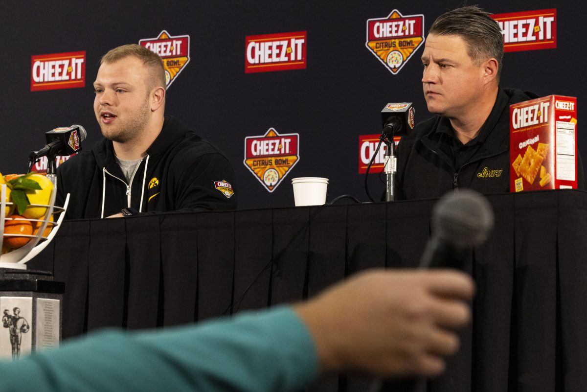 Iowa center Logan Jones answers a question during a press conference for the 2024 Cheez-It Citrus Bowl at the Rosen Plaza Hotel in Orlando, Fla., on Friday, Dec. 29, 2023. The junior stepped into the role of the center position after previous center Tyler Linderbaum entered the NFL. Offensive coordinator Brian Ferentz spoke highly about Jones and his entrance into his new role. “I dont know that we have a football player on offense who works harder, who practices harder, whos tougher, whos more committed to the football team.”