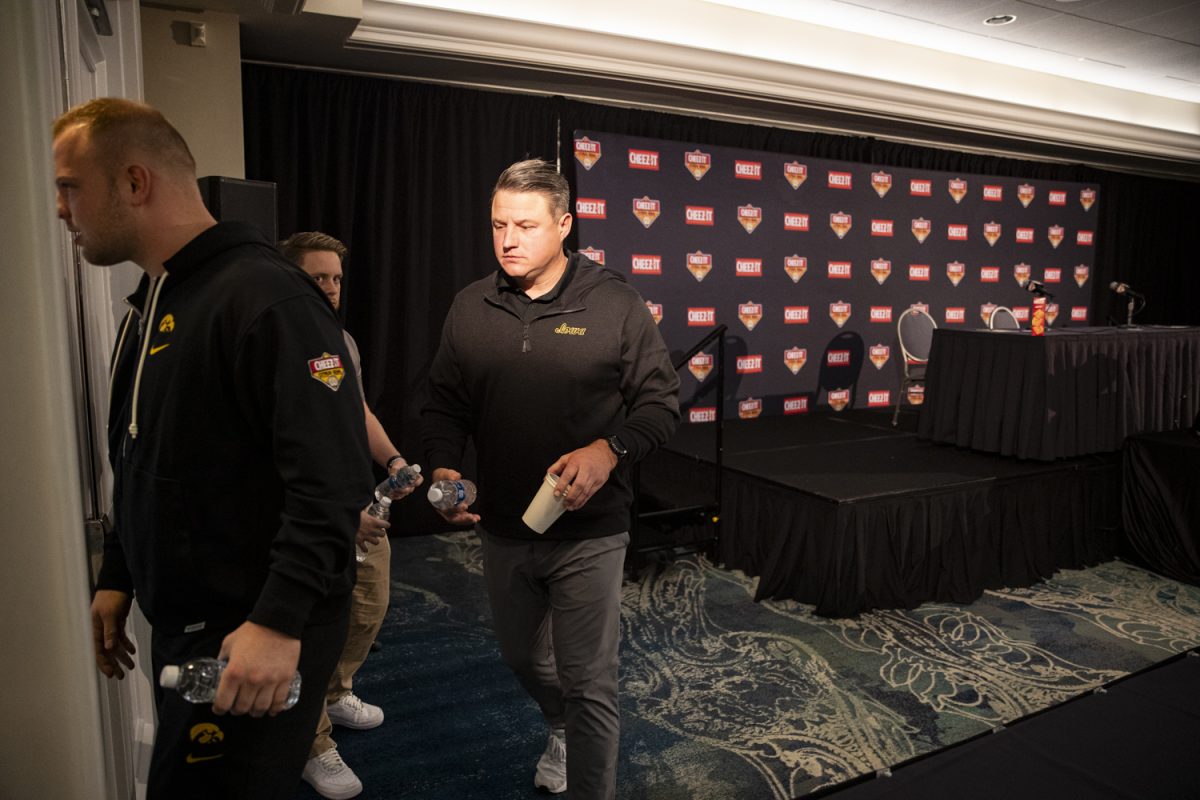 Iowa offensive coordinator Brian Ferentz walks out of the room during a press conference for the 2024 Cheez-It Citrus Bowl at the Rosen Plaza Hotel in Orlando, Fla., on Friday, Dec. 29, 2023. Ferentz spoke to reporters about his last game with the Hawkeyes on New Year’s Day, discussing his commitment to the Hawkeyes for the next few days. “My focus has been on our football team and our players and doing my job and getting them ready to play football games and trying to help them be in a position to be successful and win games,” Ferentz said. 
“So thats where I kept my focus during the season. Thats where Ive kept my focus since October.”