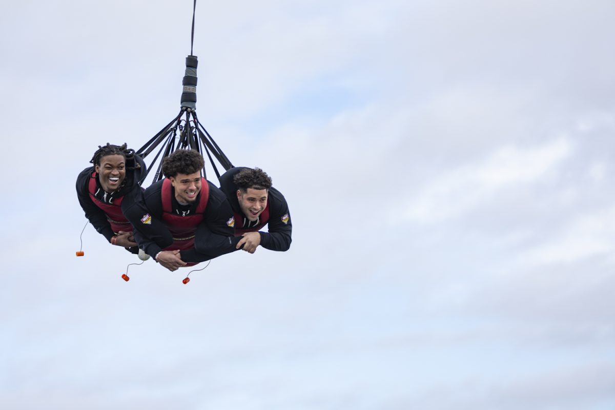 Iowa running back Jaziun Patterson and linebackers Jaden Harrell and Jayden Montgomery ride the SkyCoaster during Day for Kids, an event for the 2024 Cheez-It Citrus Bowl, at Fun Spot America on Saturday, Dec. 30, 2023. Iowa and Tennessee met with children and enjoyed a morning of roller coasters and rides at the amusement park. The teams match up at Camping World Stadium on Monday, Jan. 1, at noon CT.