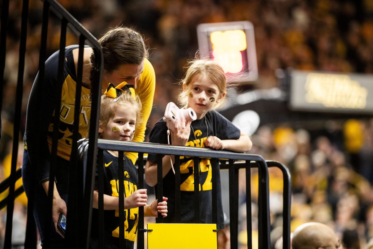 Iowa fans wait for players to take the court before a women’s basketball game between No. 4 Iowa and Minnesota at Carver-Hawkeye Arena on Saturday, Dec. 30, 2023. The Hawkeyes defeated the Golden Gophers, 94,71.