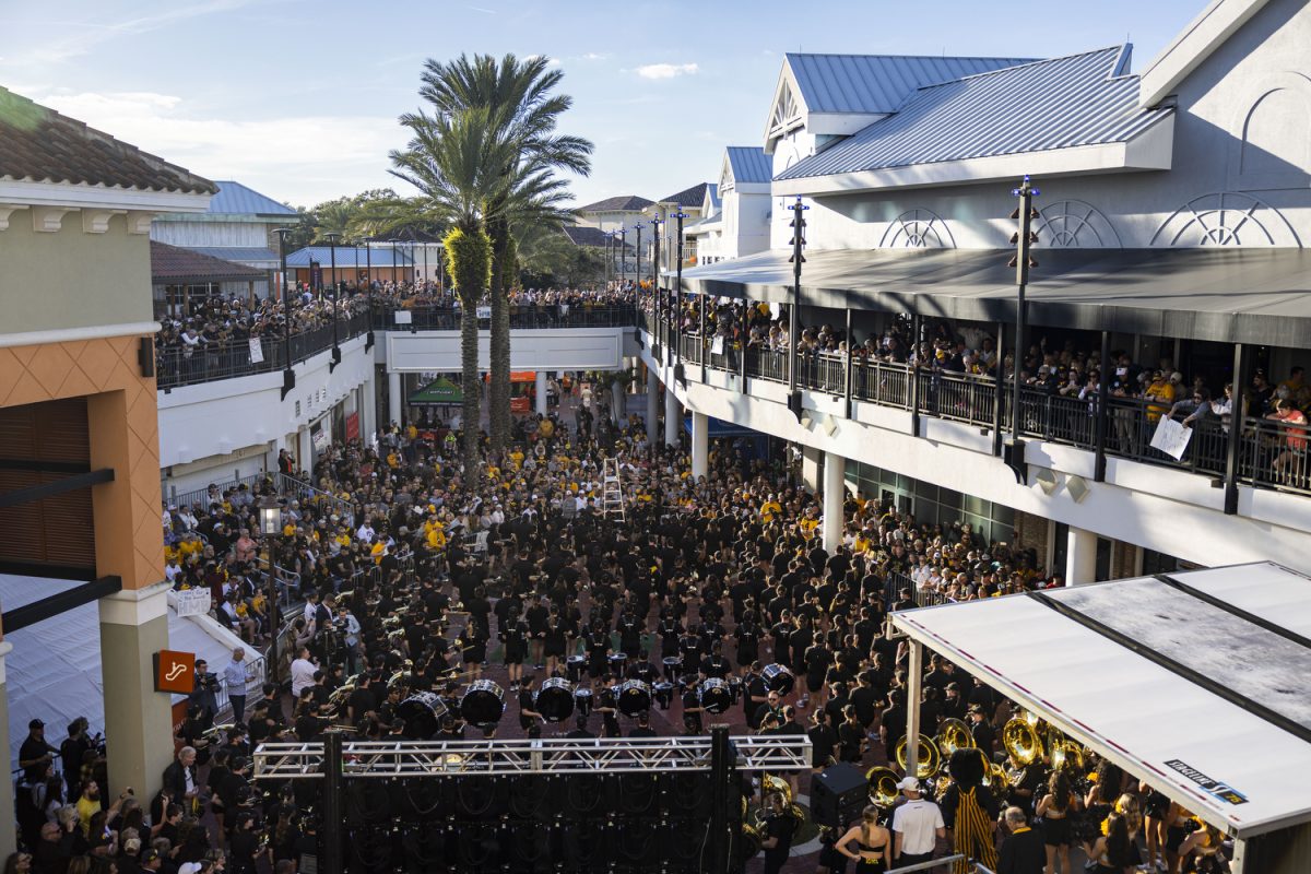 The Hawkeye Marching Band performs during a pep rally ahead of the 2024 Cheez-It Citrus Bowl with Iowa and Tennessee fans at Pointe Orlando in Florida on Sunday, Dec. 31, 2023. Both the Hawkeyes and Volunteers hosted spirit squads, marching bands, mascots, and more during the two hours of cheering and sunshine.
