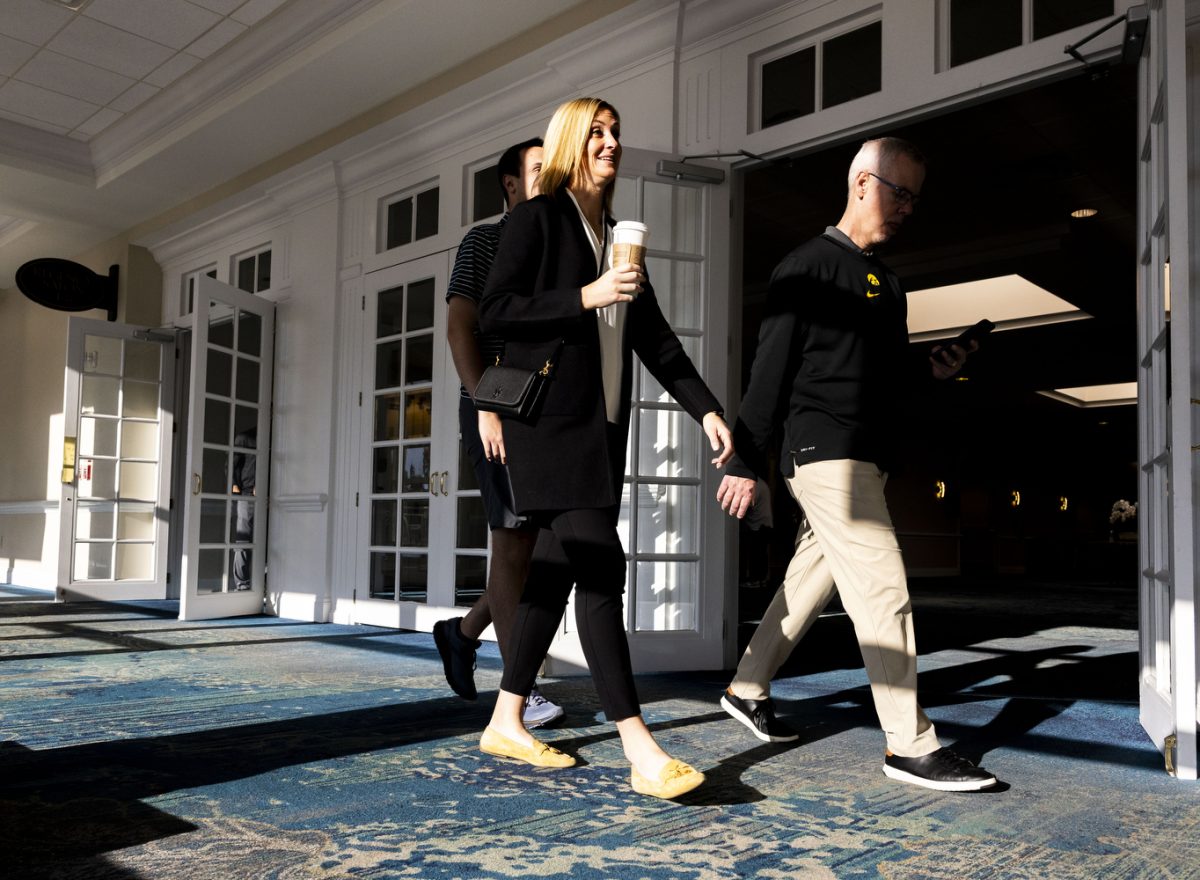 Interim Director of Athletics Chair Beth Goetz and Deputy Director of Athletics for External Relations Matt Henderson exit the conference room area after a press conference with Iowa head coach Kirk Ferentz and Tennessee head coach Josh Heupel at the Rosen Plaza Hotel in Orlando, Fla., on Sunday, Dec. 31, 2023. The teams match up at Camping World Stadium on Monday, Jan. 1, at noon CT.