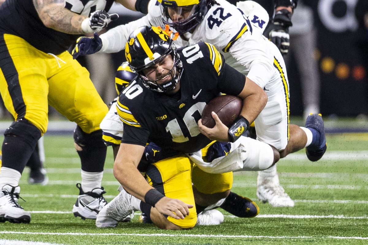 Michigan+defensive+end+Derrick+Moore+sacks+Iowa+quarterback+Deacon+Hill+to+end+the+game+during+a+football+game+between+No.+18+Iowa+and+No.+2+Michigan+at+Lucas+Oil+Stadium+in+Indianapolis+on+Saturday%2C+Dec.+2%2C+2023.+The+Wolverines+defeated+the+Hawkeyes%2C+26-0.+Moore+had+one+tackle.