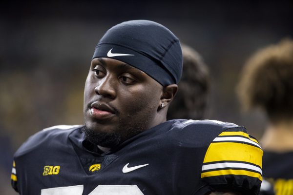 Iowa offensive lineman Daijon Parker stands on the sidelines during a football game between No. 18 Iowa and No. 2 Michigan at Lucas Oil Stadium in Indianapolis on Saturday, Dec. 2, 2023. The Wolverines defeated the Hawkeyes, 26-0.